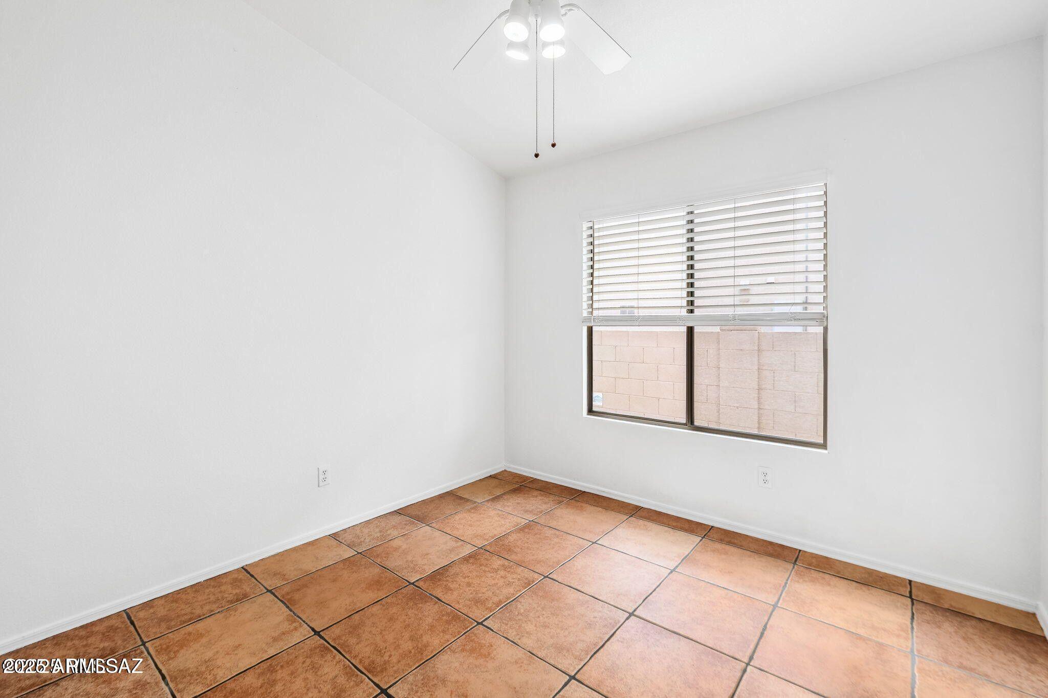 11161 North Par Drive Oro Valley, AZ 85737 - Photo 23 of 35 an empty room with windows