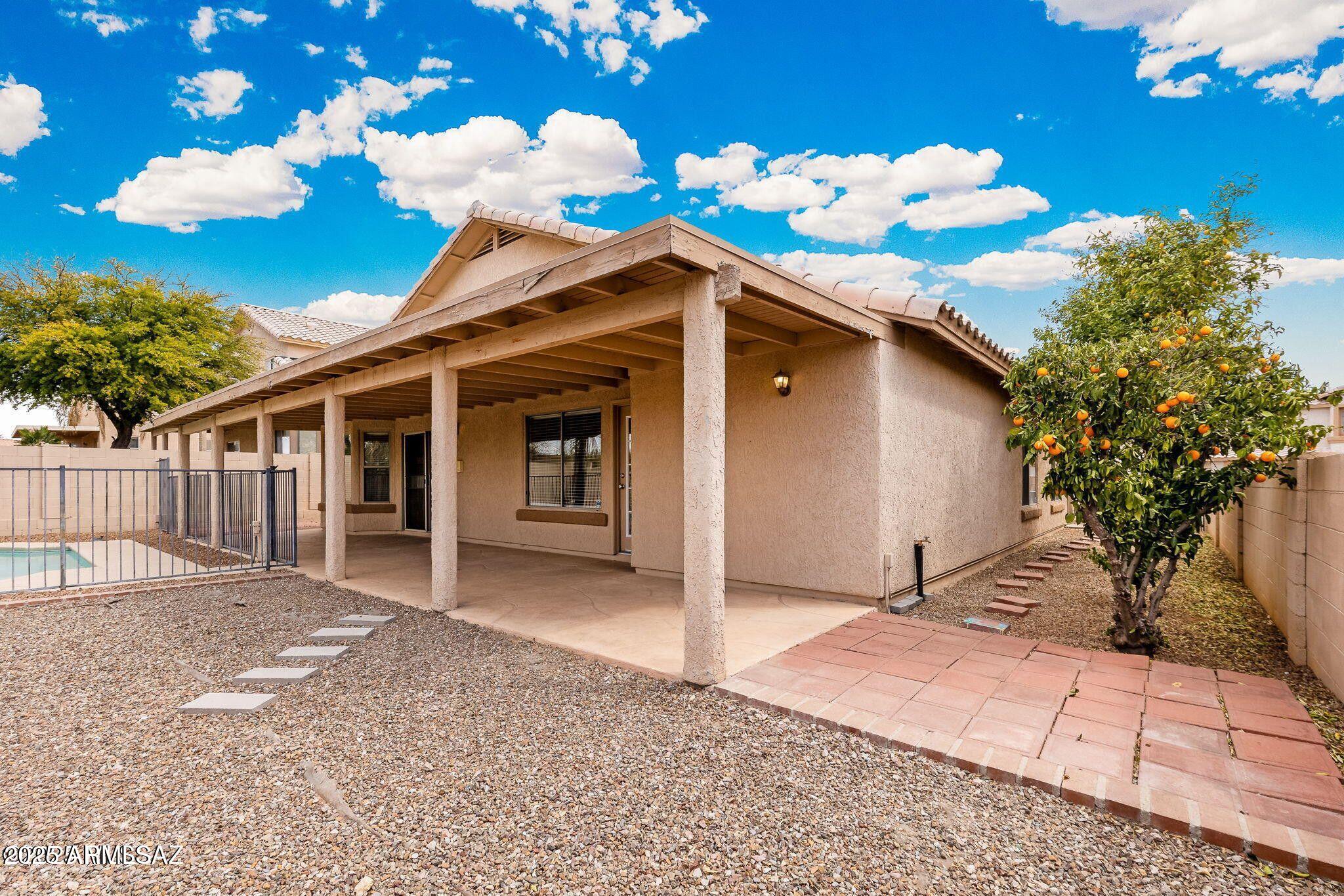 11161 North Par Drive Oro Valley, AZ 85737 - Photo 31 of 35 a front view of a house with a chandelier