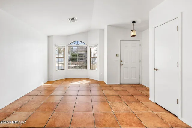 a view of an empty room and window
