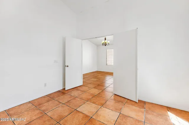 a view of a room with wooden floor and cabinet
