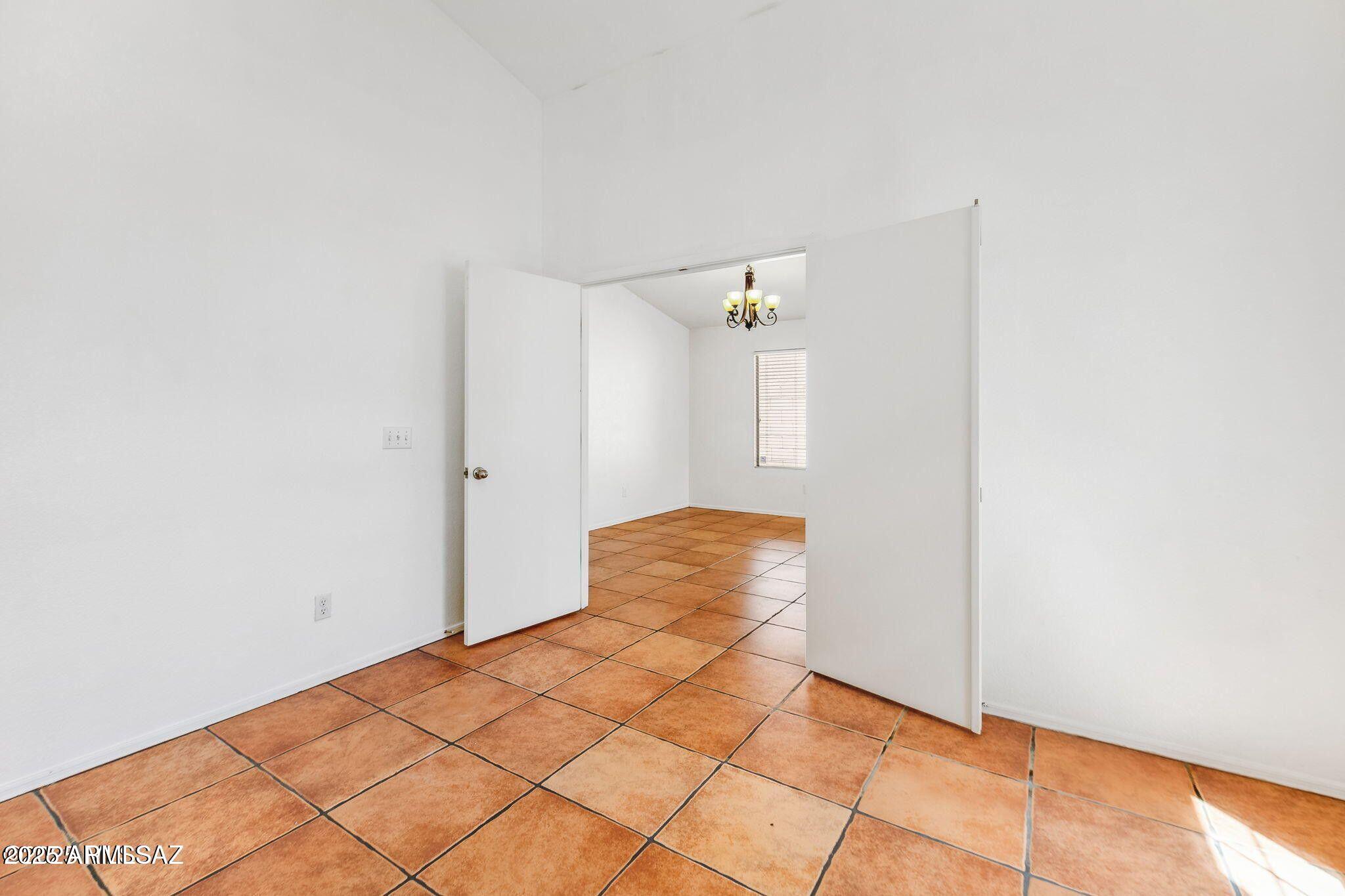 11161 North Par Drive Oro Valley, AZ 85737 - Photo 9 of 35 a view of a room with wooden floor and cabinet
