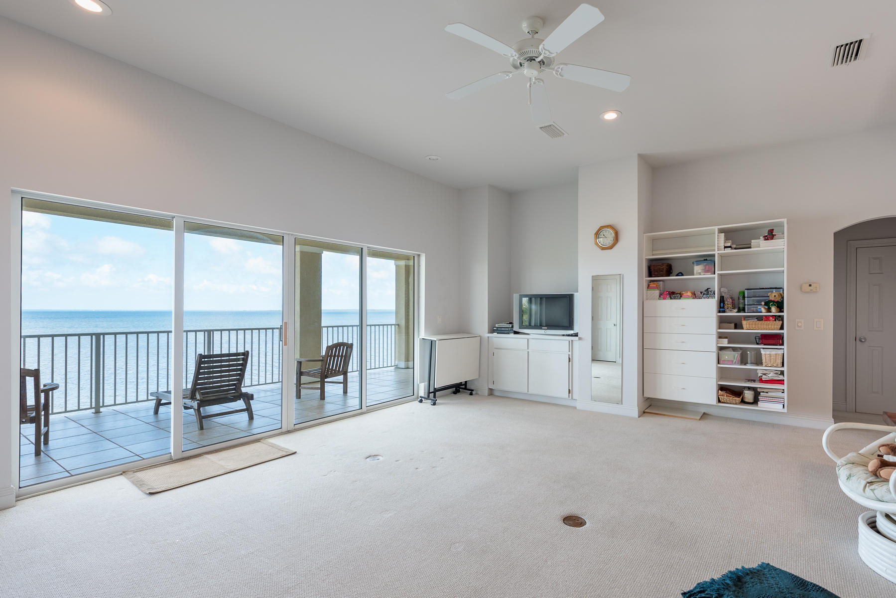 1789 Driftwood Point Road Santa Rosa Beach, FL 32459 - Photo 40 of 47 a living room with furniture and large windows
