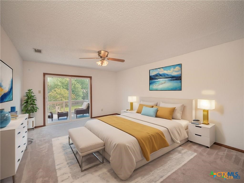 3901 Chisholm Trail, Unit 12 Salado, TX 76571 - Photo 5 of 9 a bedroom with a large bed and a large window