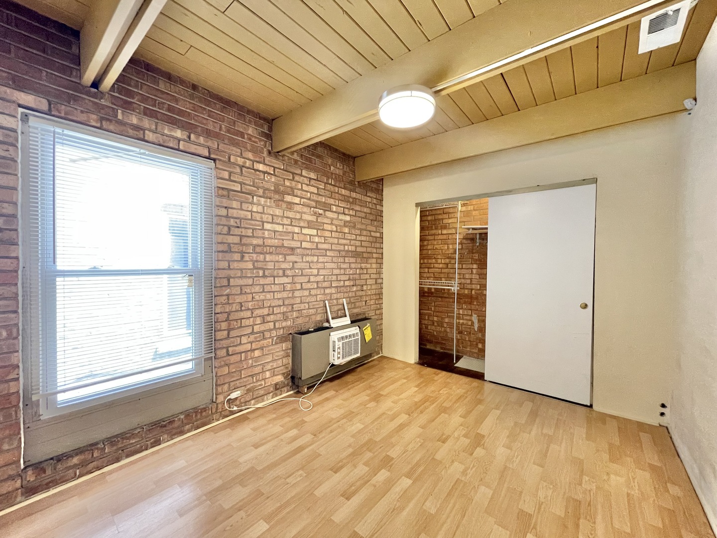 806 South Loomis Street, Unit B Chicago, IL 60607 - Photo 11 of 17 a view of an empty room with a window
