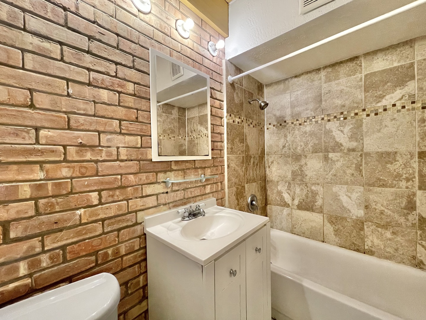 806 South Loomis Street, Unit B Chicago, IL 60607 - Photo 15 of 17 a bathroom with a sink toilet and shower