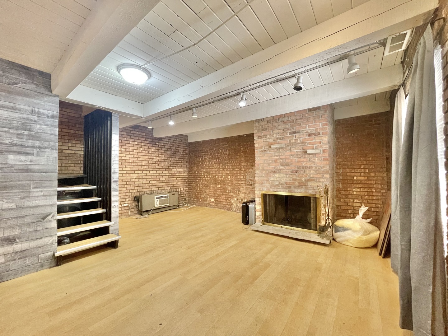 806 South Loomis Street, Unit B Chicago, IL 60607 - Photo 3 of 17 a view of a livingroom with a fireplace and workspace