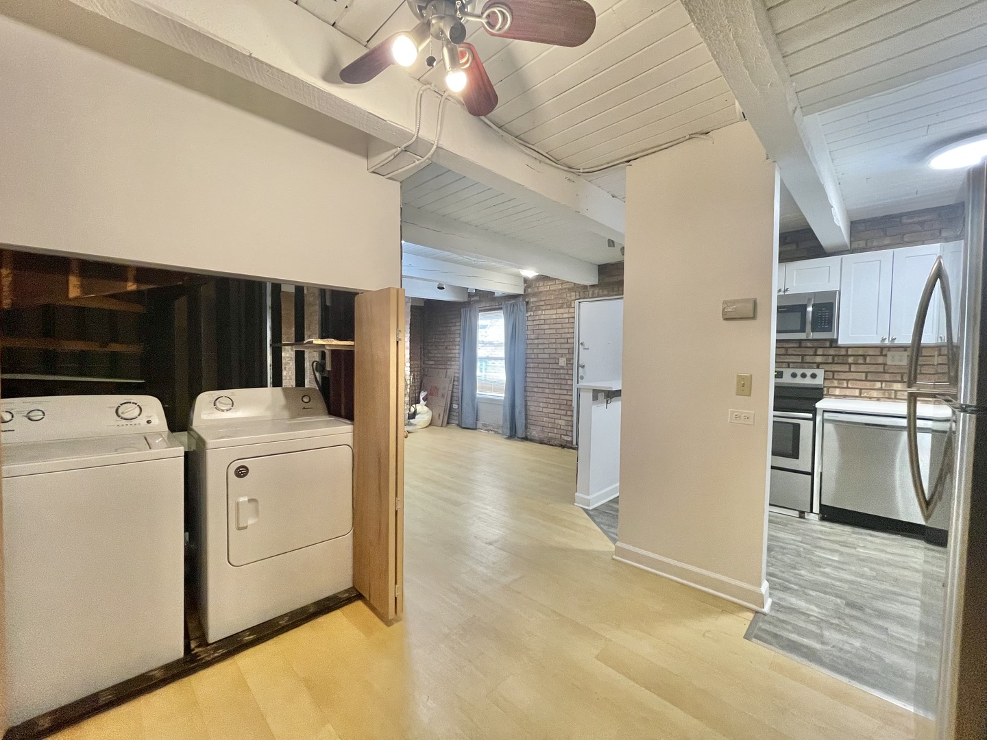 806 South Loomis Street, Unit B Chicago, IL 60607 - Photo 6 of 17 a view of a kitchen with a sink and dishwasher a refrigerator with wooden floor
