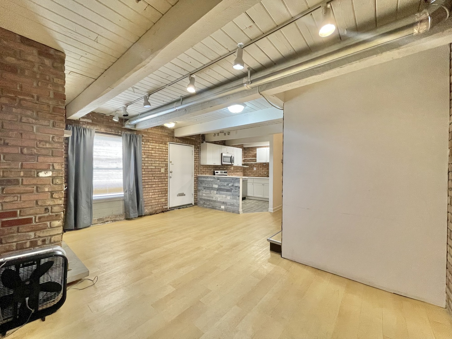 806 South Loomis Street, Unit B Chicago, IL 60607 - Photo 8 of 17 a view of a livingroom with a staircase
