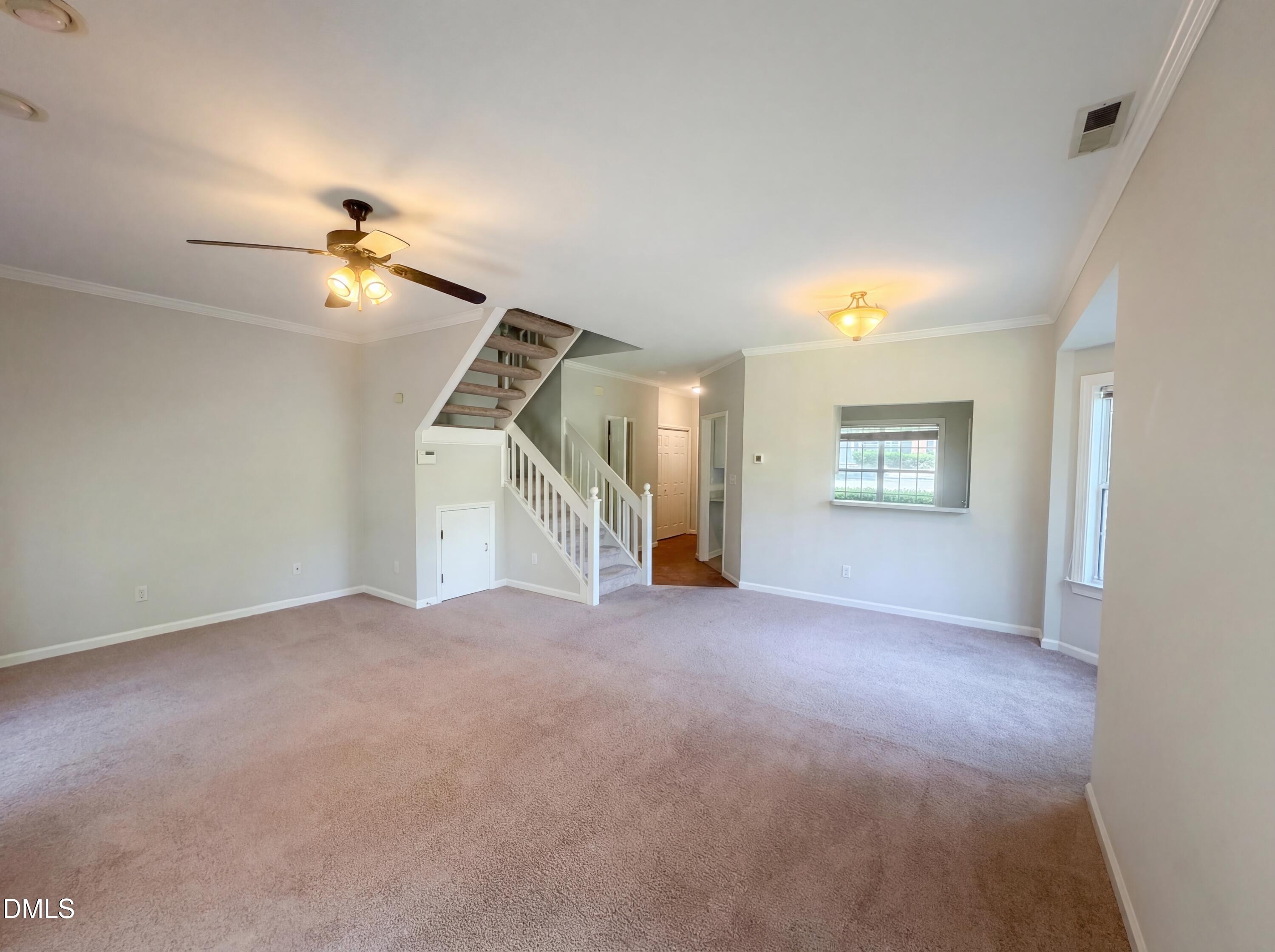 4321 Pine Springs Court Raleigh, NC 27613 - Photo 13 of 15 a view of empty room with stairs