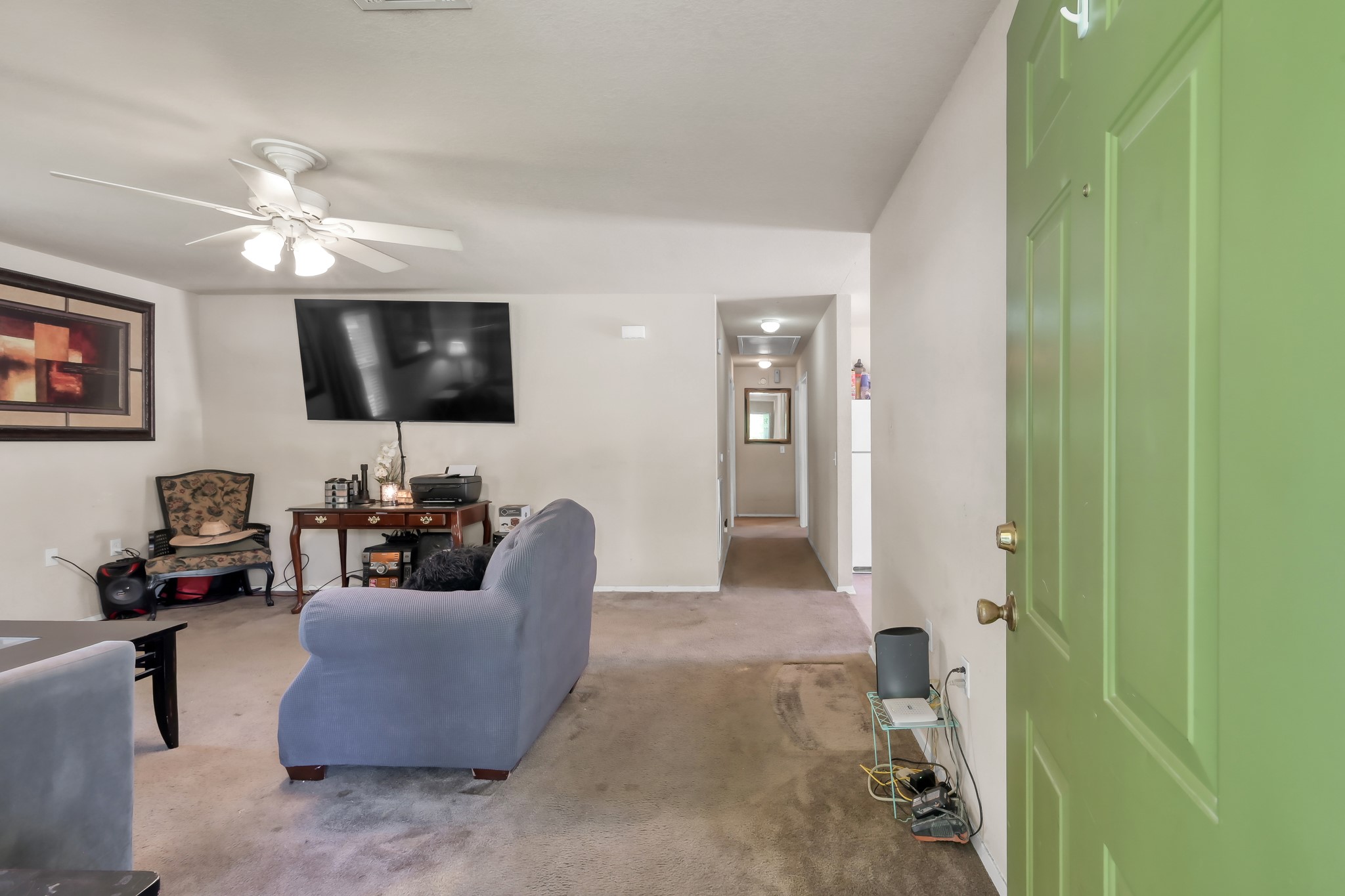 805 Webb Street Conroe, TX 77301 - Photo 4 of 19 a living room with furniture and a flat screen tv