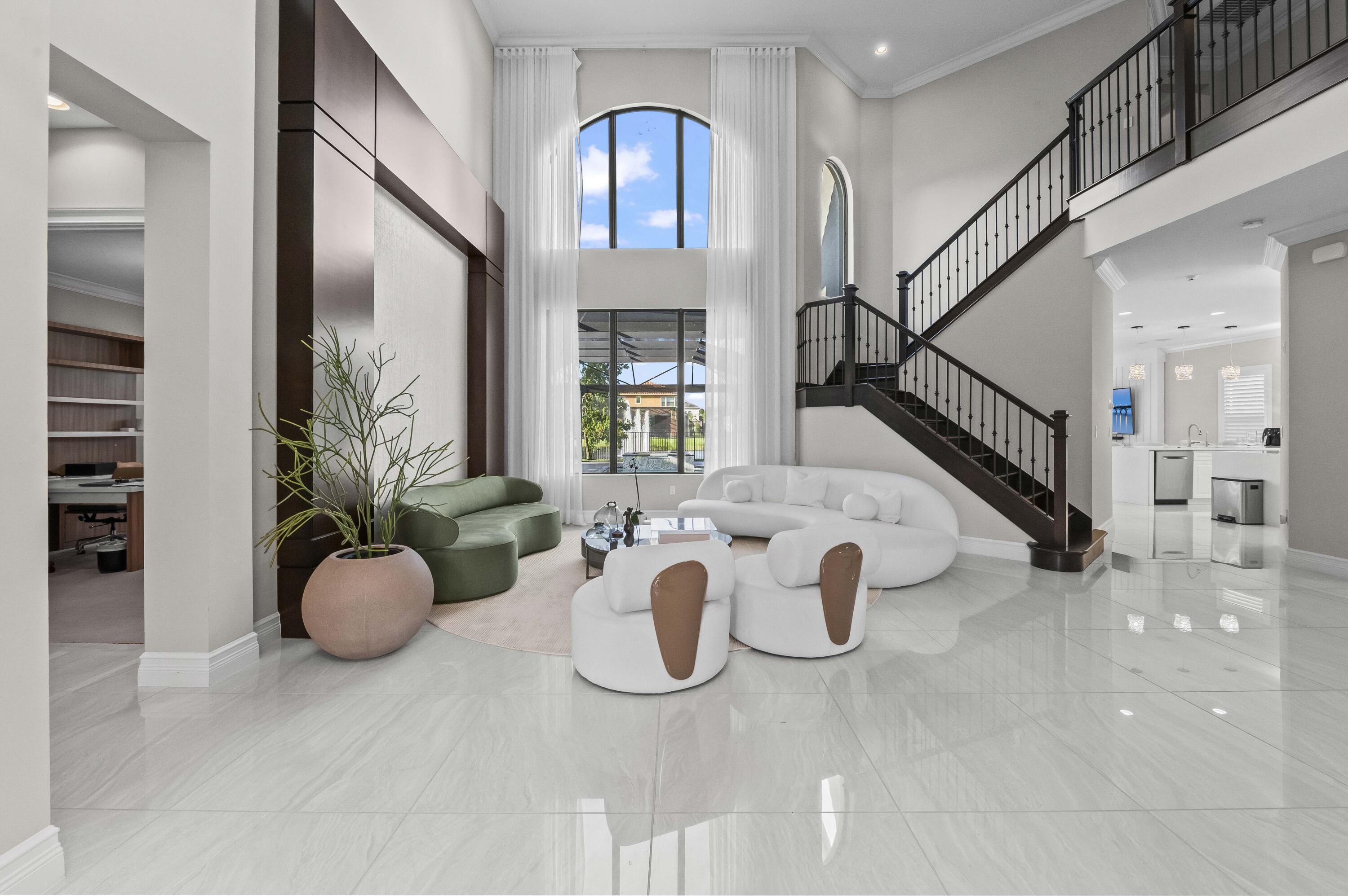 9795 Rennes Lane Delray Beach, FL 33446 - Photo 2 of 79 a view of entryway with livingroom and furniture