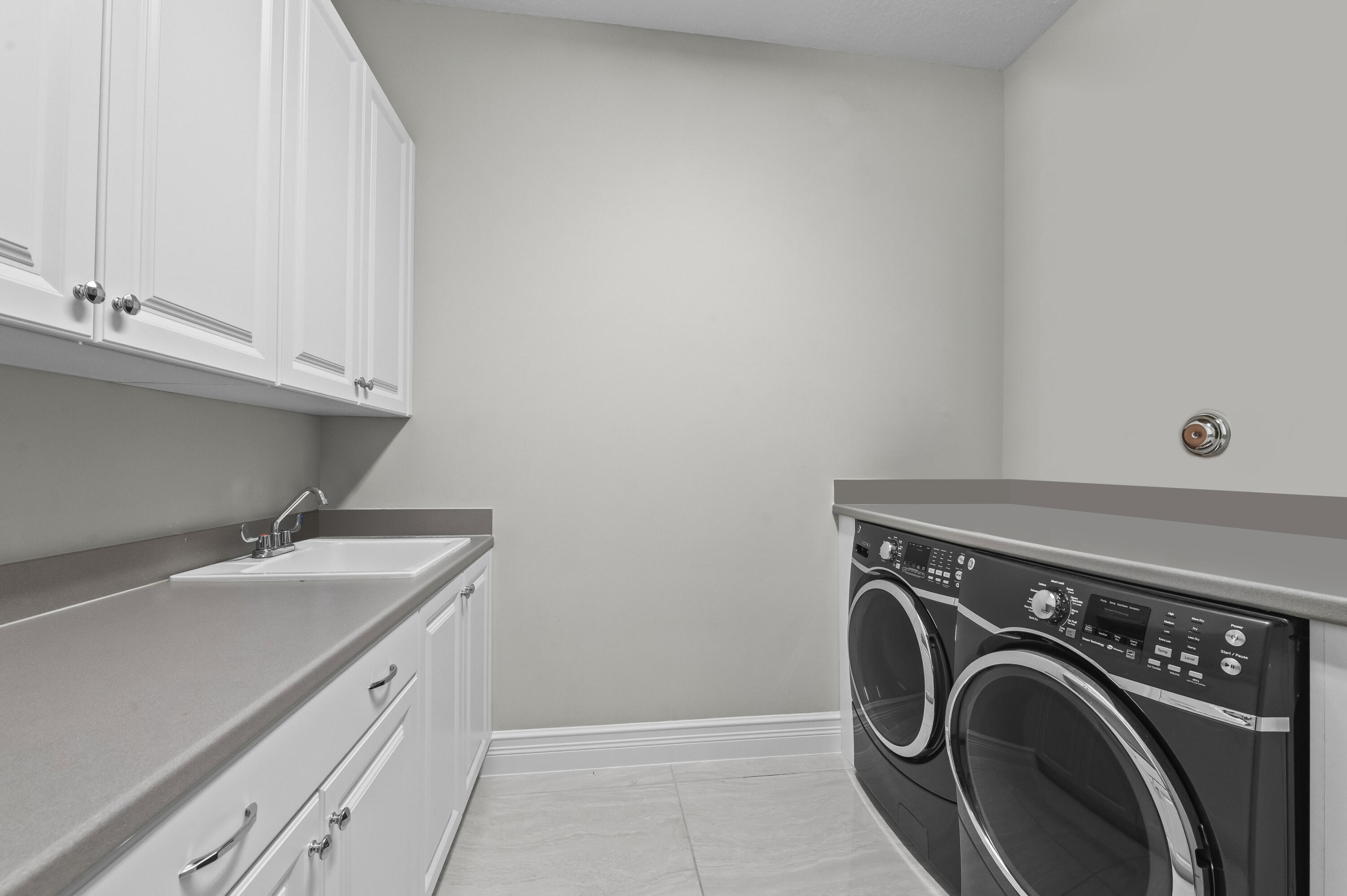 9795 Rennes Lane Delray Beach, FL 33446 - Photo 26 of 79 a utility room with dryer and washer