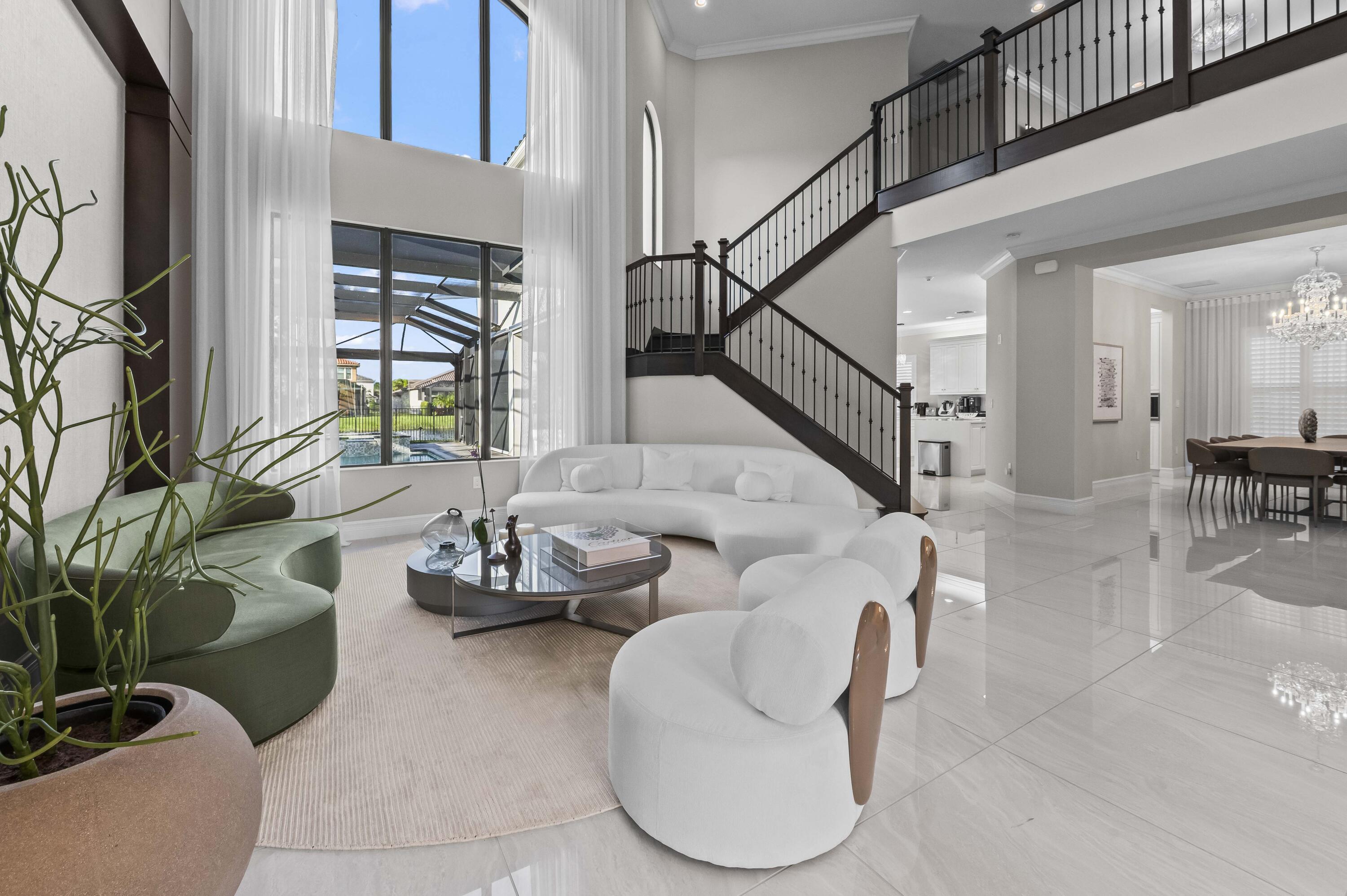 9795 Rennes Lane Delray Beach, FL 33446 - Photo 3 of 79 a living room with furniture and a potted plant