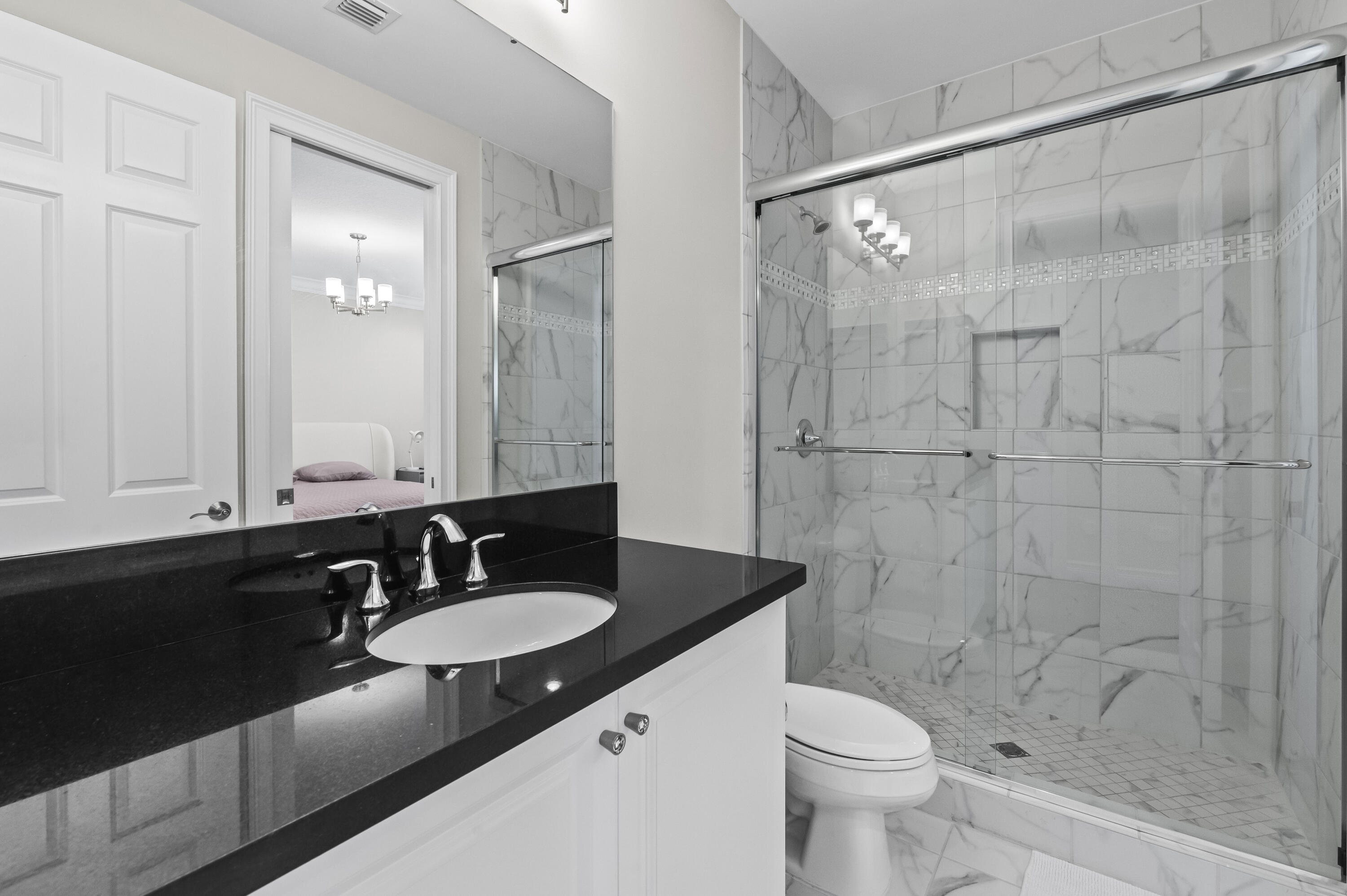 9795 Rennes Lane Delray Beach, FL 33446 - Photo 31 of 79 a bathroom with a sink and a mirror