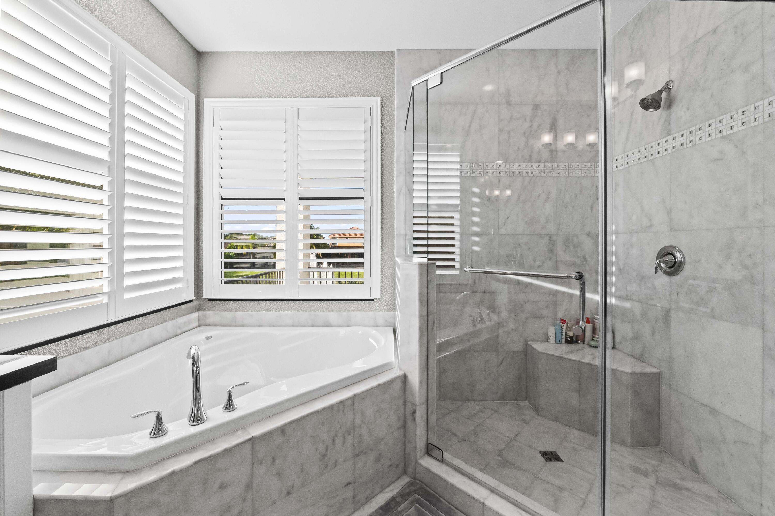 9795 Rennes Lane Delray Beach, FL 33446 - Photo 46 of 79 a white bath tub sitting next to a shower