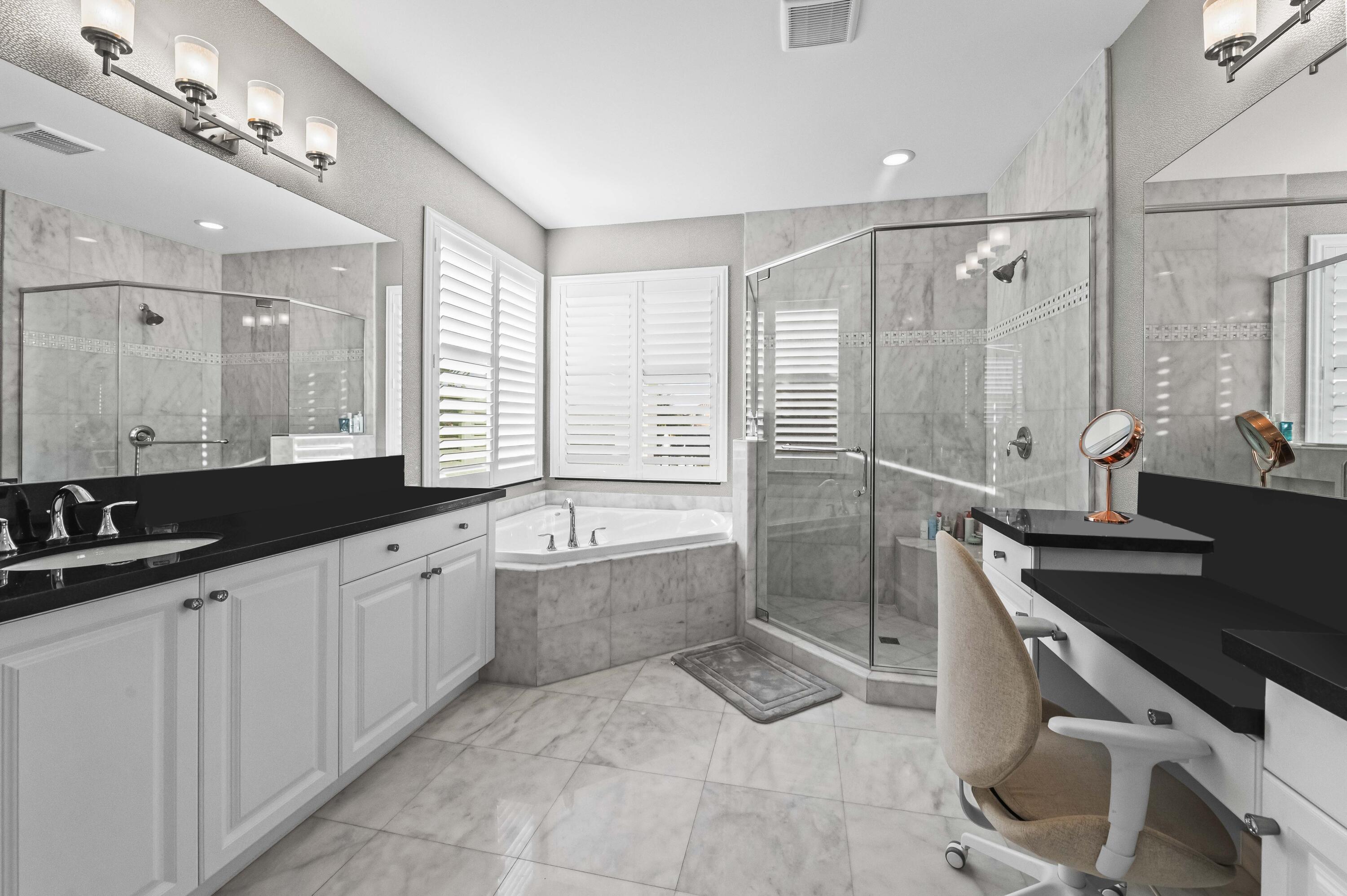 9795 Rennes Lane Delray Beach, FL 33446 - Photo 47 of 79 a large bathroom with a double vanity sink a mirror and a bathtub