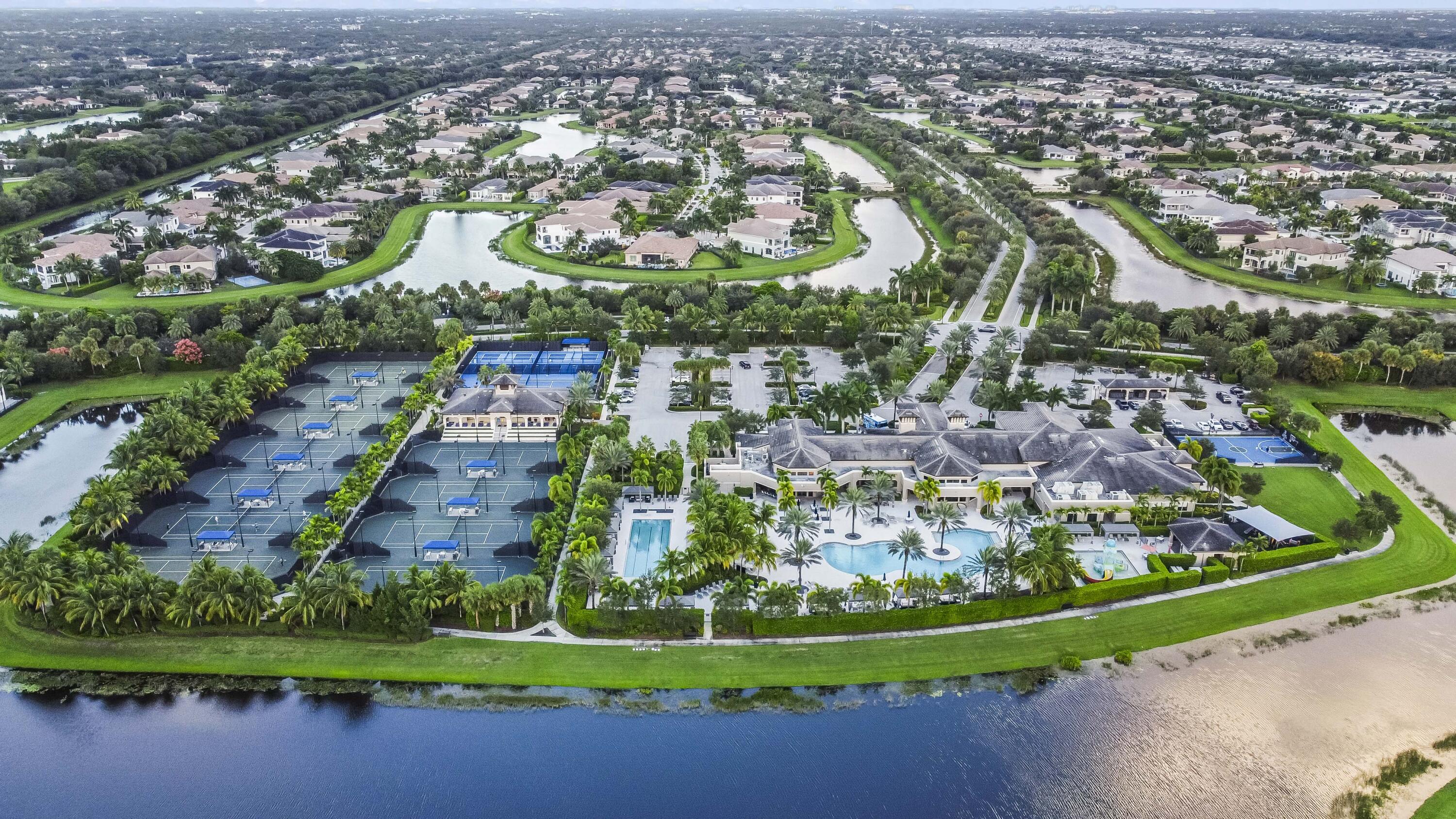 9795 Rennes Lane Delray Beach, FL 33446 - Photo 69 of 79 an aerial view of residential houses with outdoor space and swimming pool