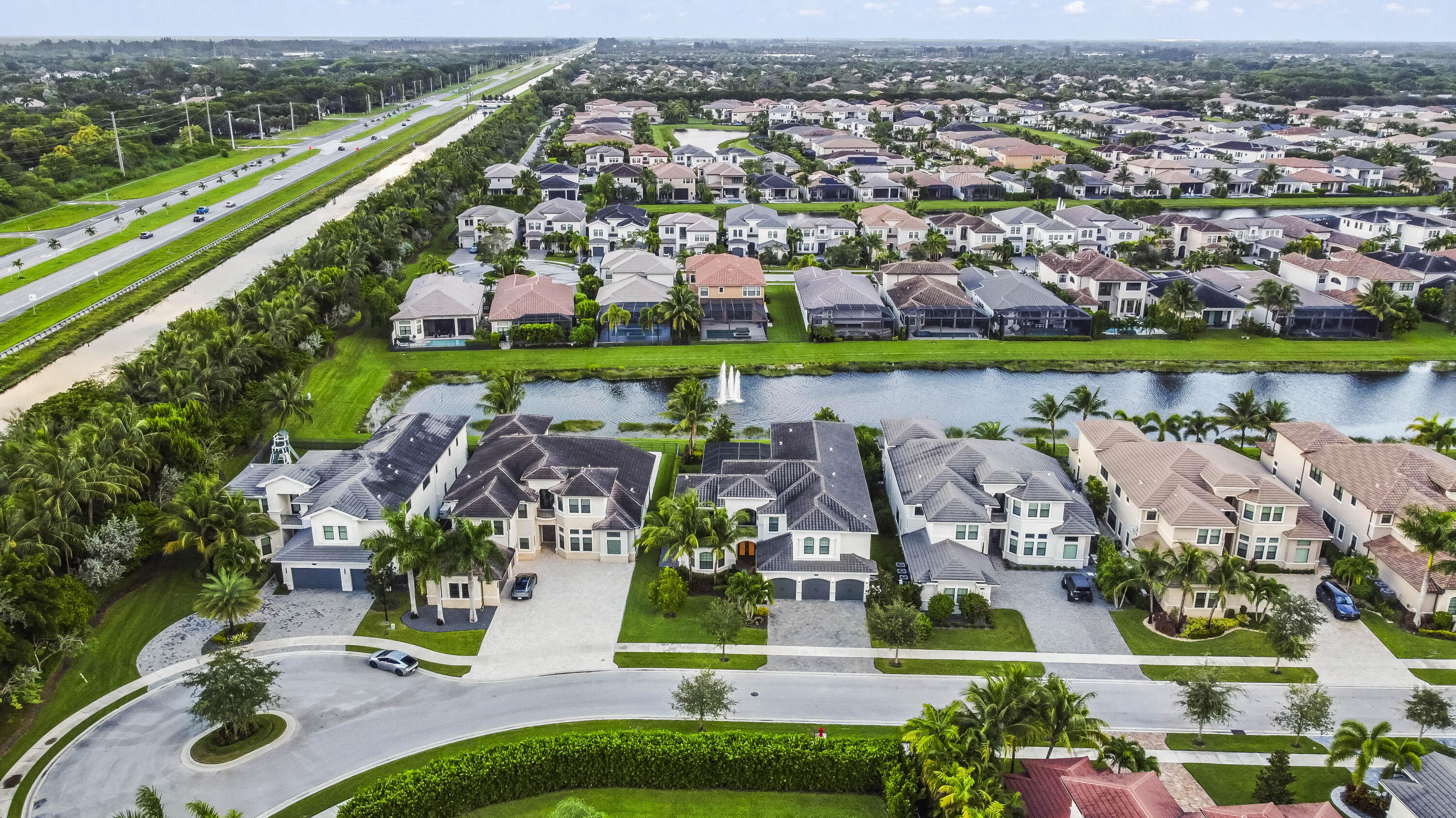 9795 Rennes Lane Delray Beach, FL 33446 - Photo 74 of 79 an aerial view of multiple house with a yard and lake view