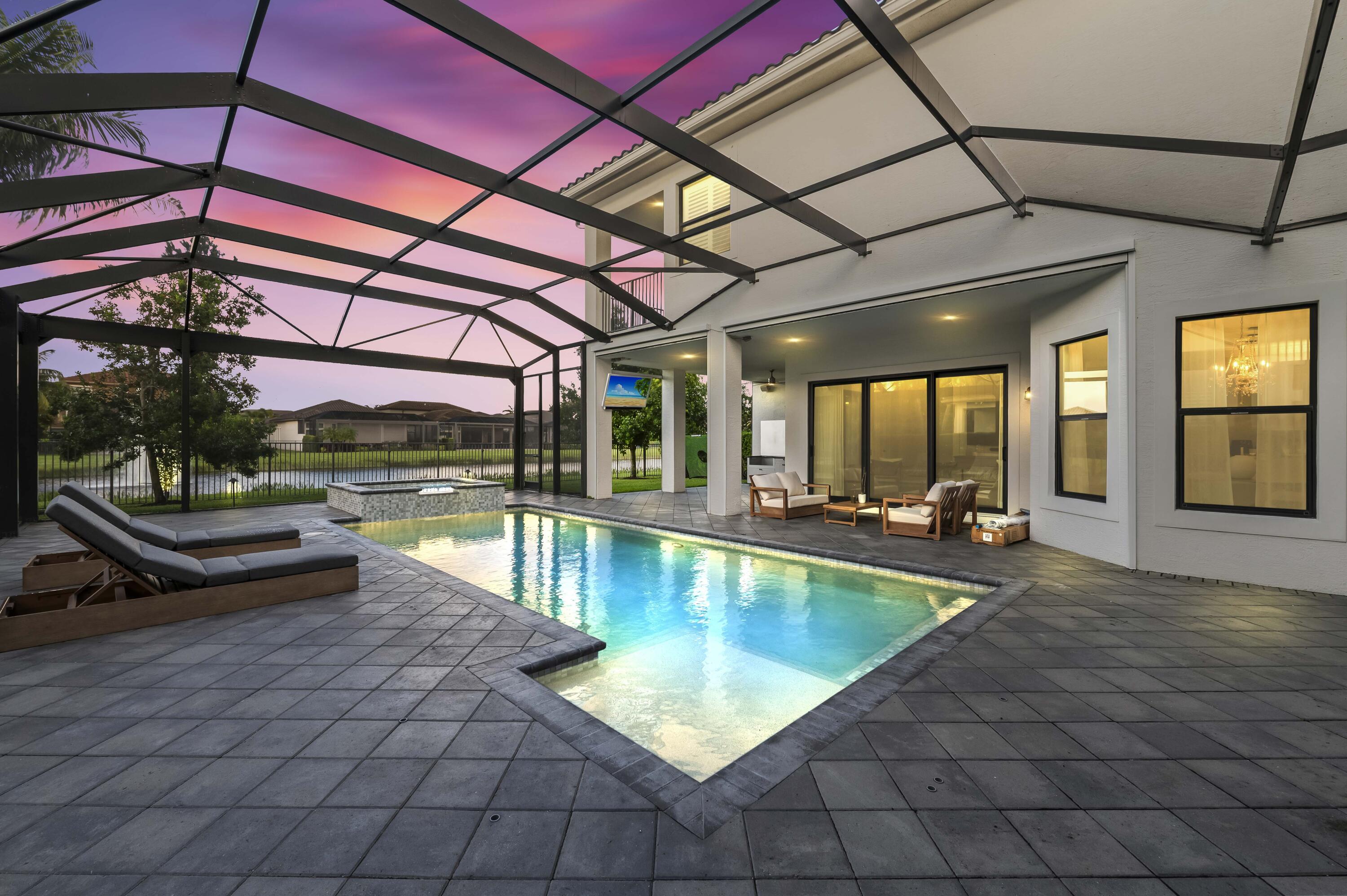 9795 Rennes Lane Delray Beach, FL 33446 - Photo 78 of 79 a view of a swimming pool with a patio