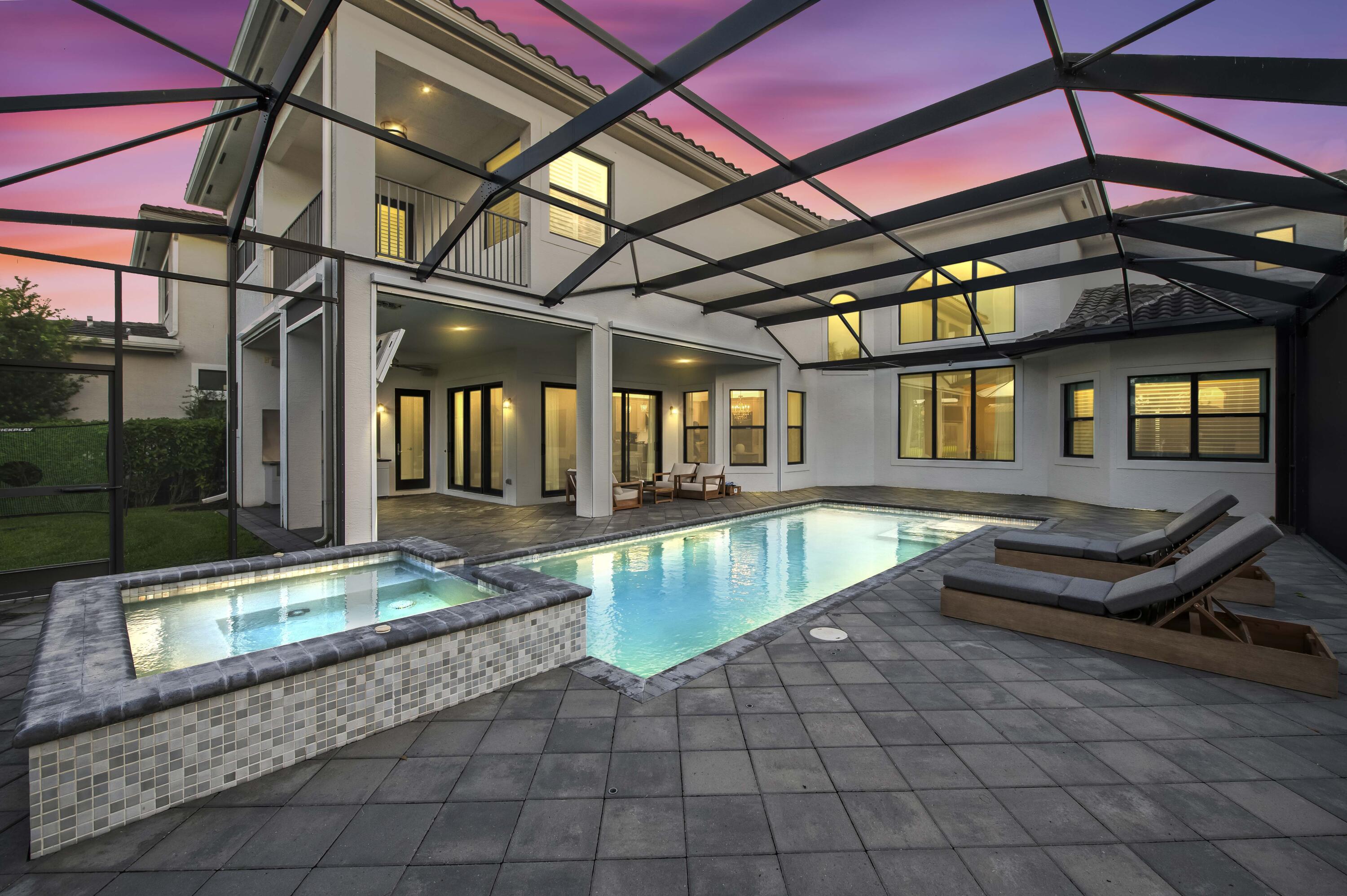 9795 Rennes Lane Delray Beach, FL 33446 - Photo 79 of 79 a swimming pool with patio outdoor seating and yard