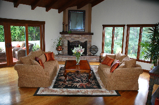 855 Miramonte Drive Santa Barbara, CA 93109 - Photo 2 of 25 a living room with furniture large window and a fireplace