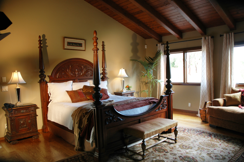 855 Miramonte Drive Santa Barbara, CA 93109 - Photo 6 of 25 a bedroom with a bed and wooden floor