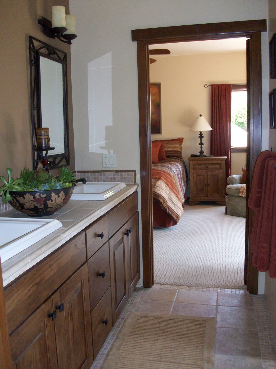 855 Miramonte Drive Santa Barbara, CA 93109 - Photo 10 of 25 a en suite bathroom with a double vanity sink and a mirror
