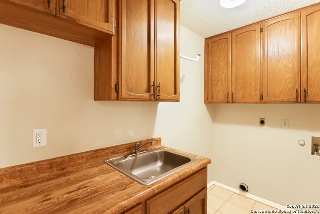 a bathroom with a sink and a window