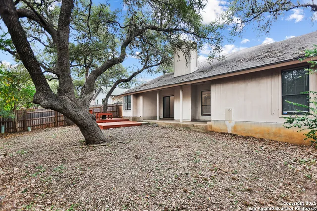 a house with trees in the background