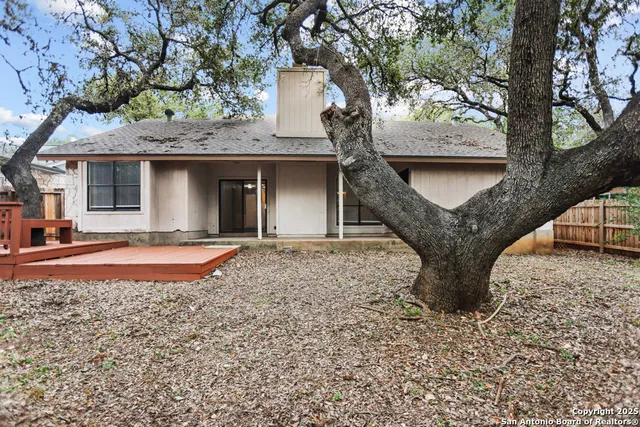 a house with trees in front of it
