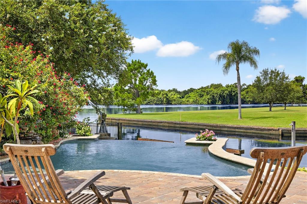 a view of a swimming pool with a lounge chair