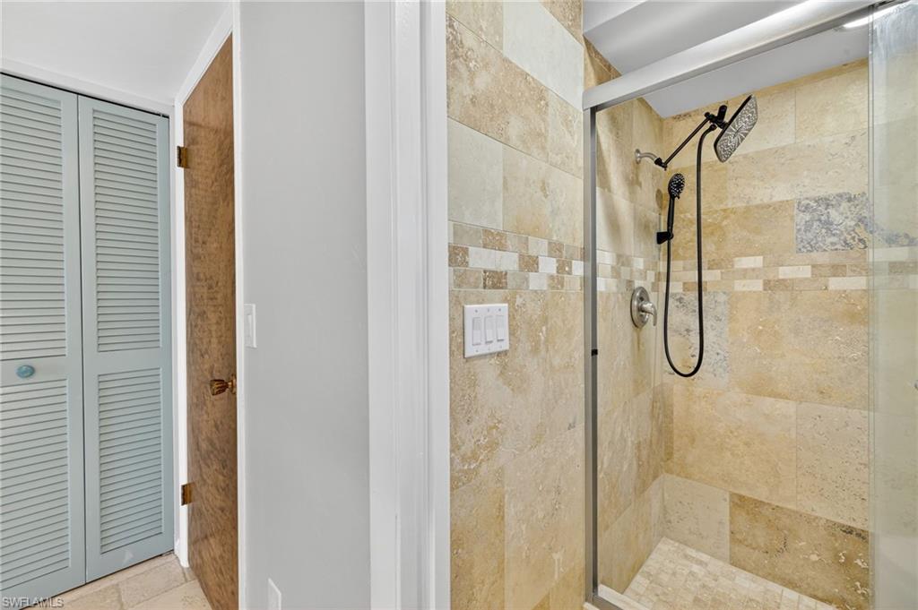 18071 Traverse Drive Alva, FL 33920 - Photo 17 of 50 a bathroom with a glass shower door