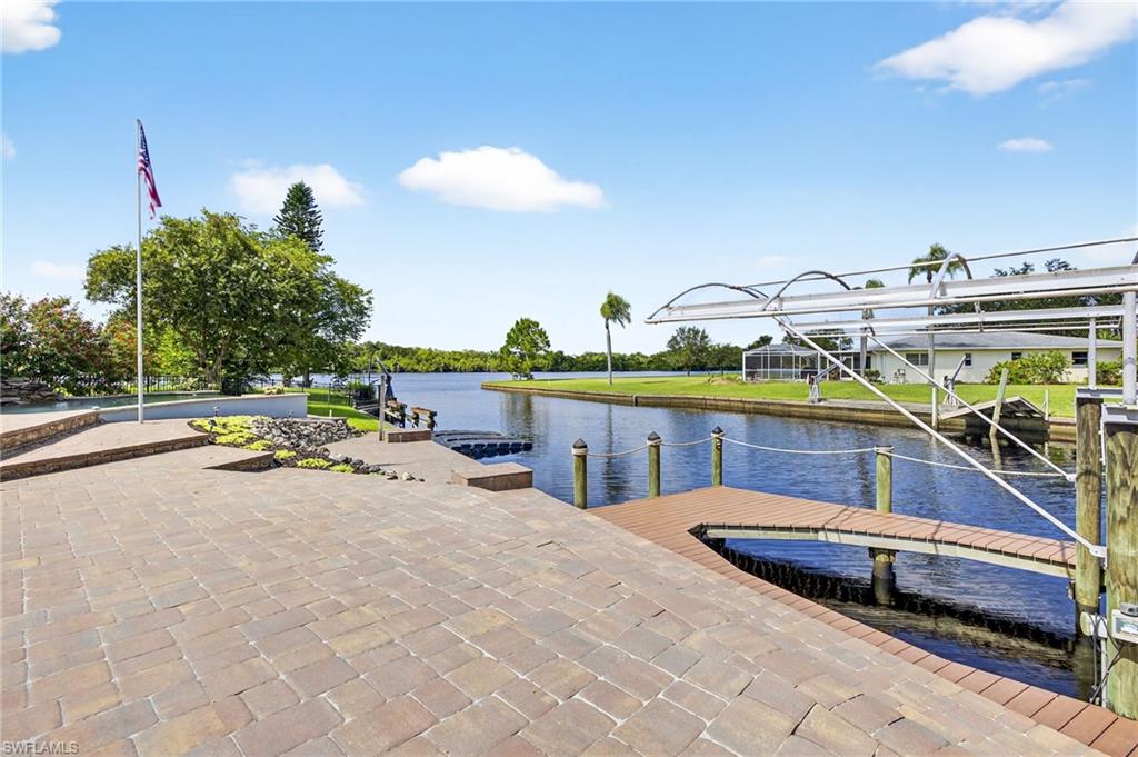 18071 Traverse Drive Alva, FL 33920 - Photo 29 of 50 a view of a swimming pool with a lounge chairs