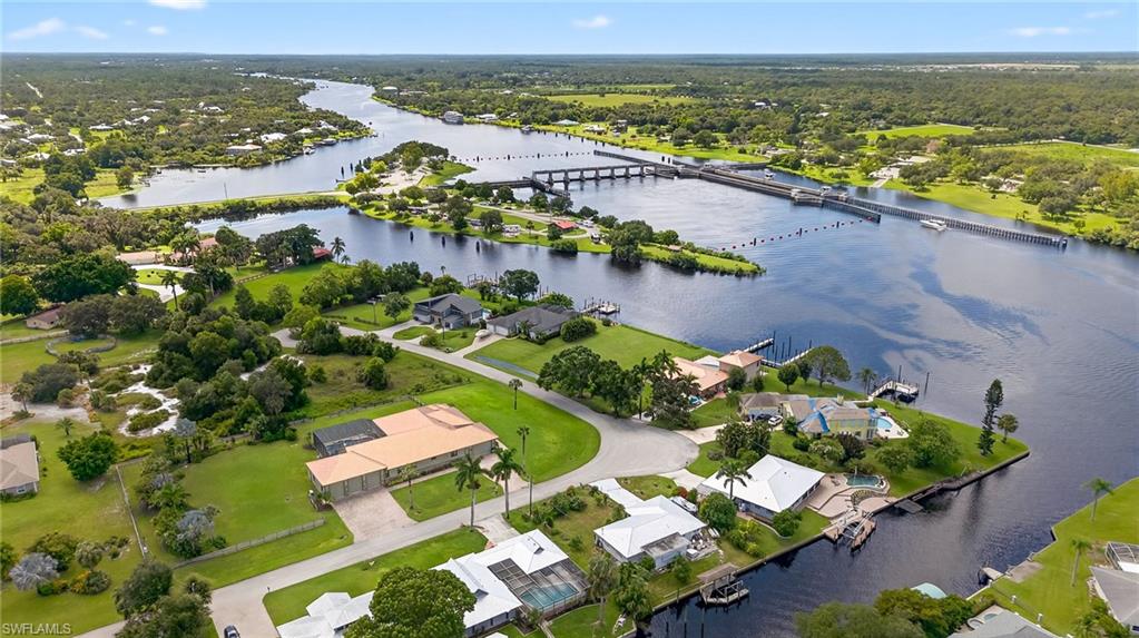 18071 Traverse Drive Alva, FL 33920 - Photo 43 of 50 an aerial view of lake and residential houses with outdoor space
