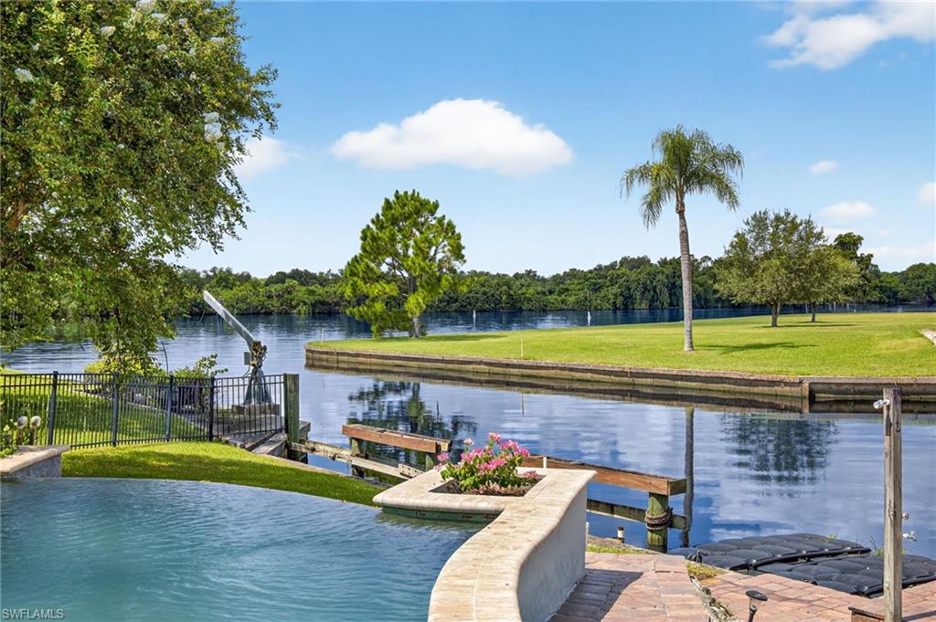 18071 Traverse Drive Alva, FL 33920 - Photo 49 of 50 a view of a house with swimming pool and a yard