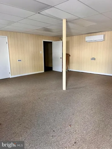 a view of an empty room and closet area