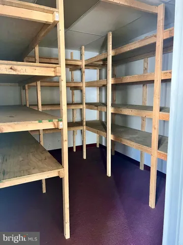 a view of an empty room with a cabinet