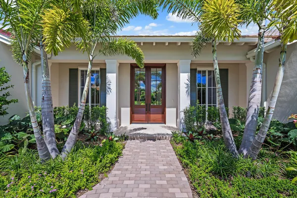 a front view of a house having garden