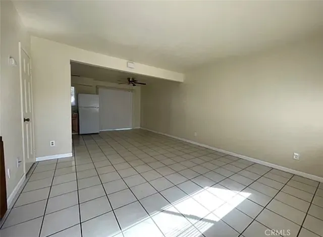 a view of an empty room and window