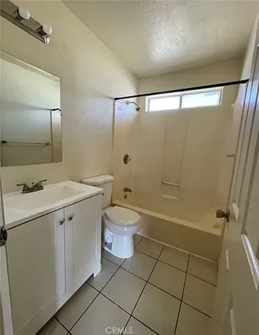 a bathroom with a double vanity sink toilet and shower
