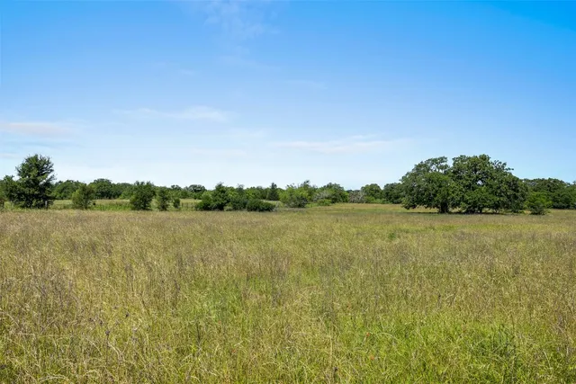 a view of lake with green space