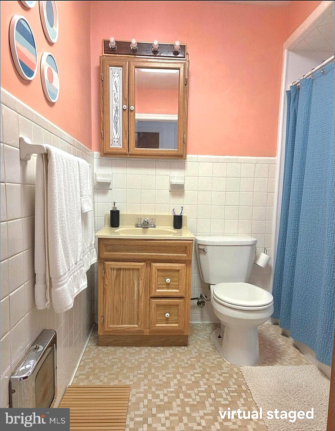 601 Edlon Park Cambridge, MD 21613 - Photo 13 of 19 a bathroom with a toilet a sink and a mirror