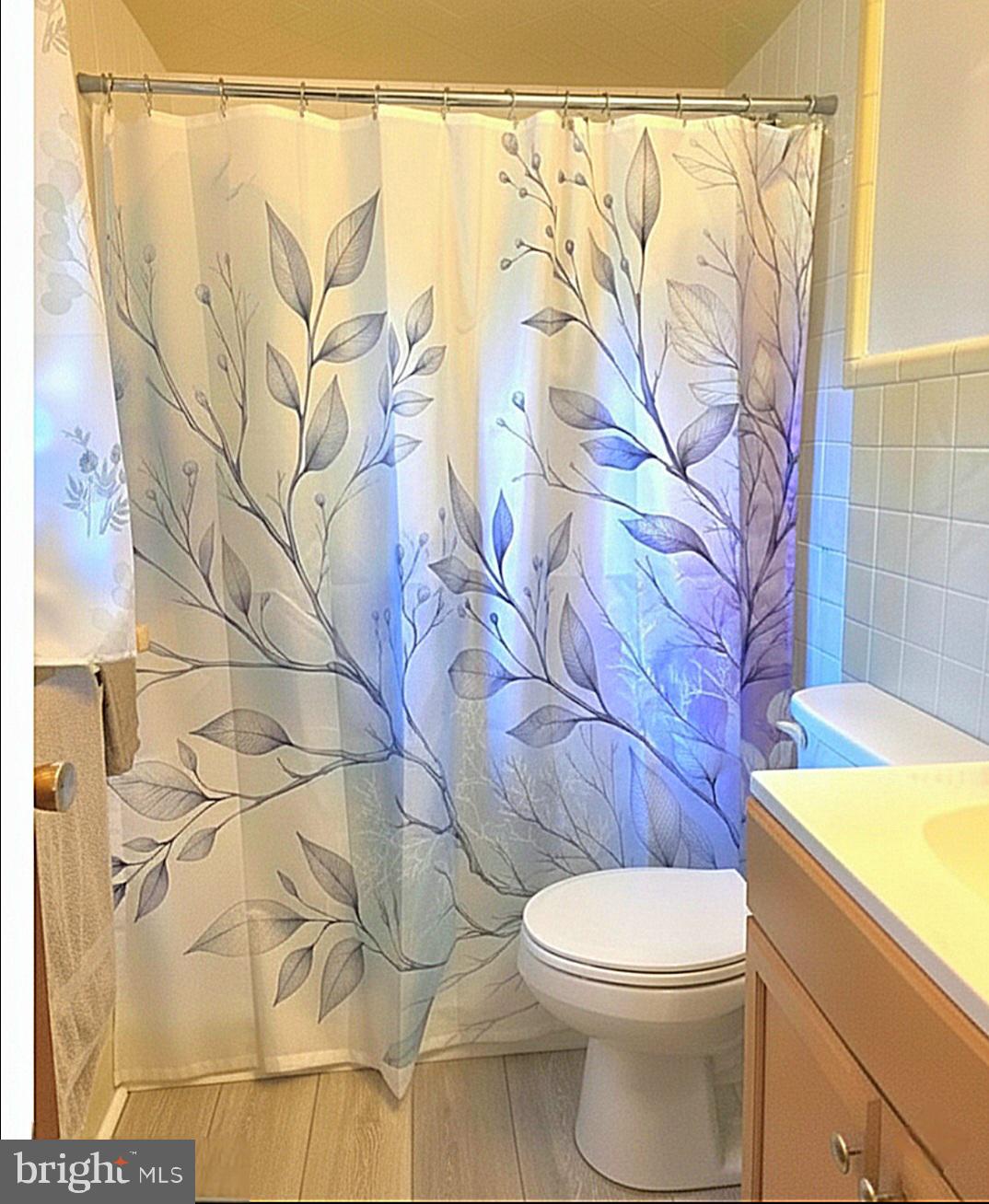 601 Edlon Park Cambridge, MD 21613 - Photo 15 of 19 a white toilet sitting next to a white curtain