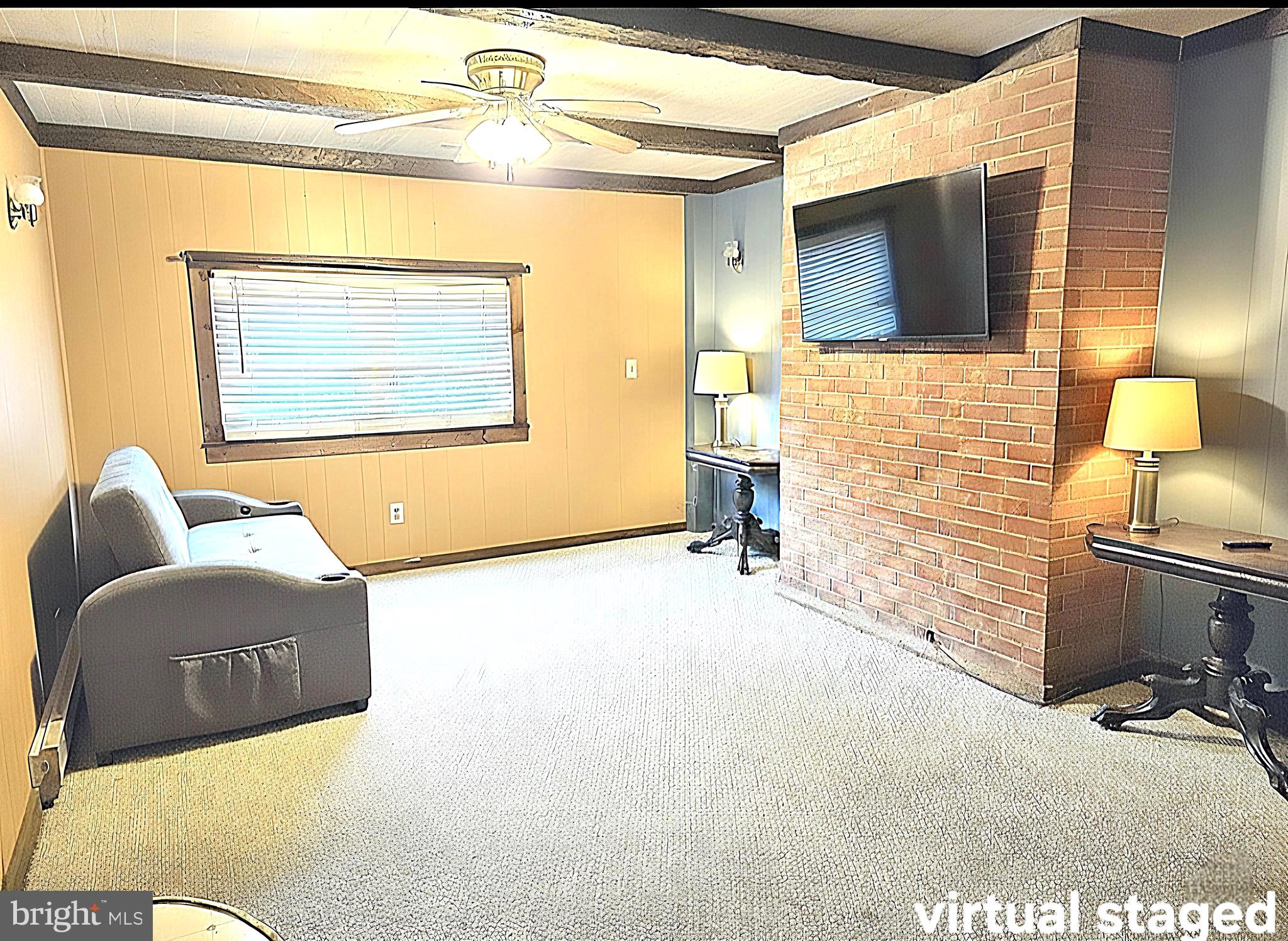 601 Edlon Park Cambridge, MD 21613 - Photo 18 of 19 a living room with a couch and a flat screen tv