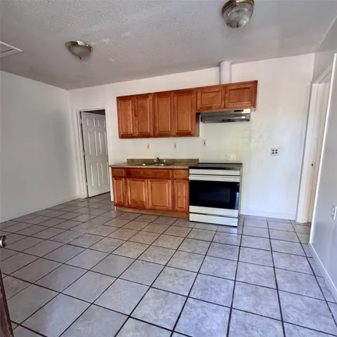 a kitchen with stainless steel appliances a sink and a stove top oven