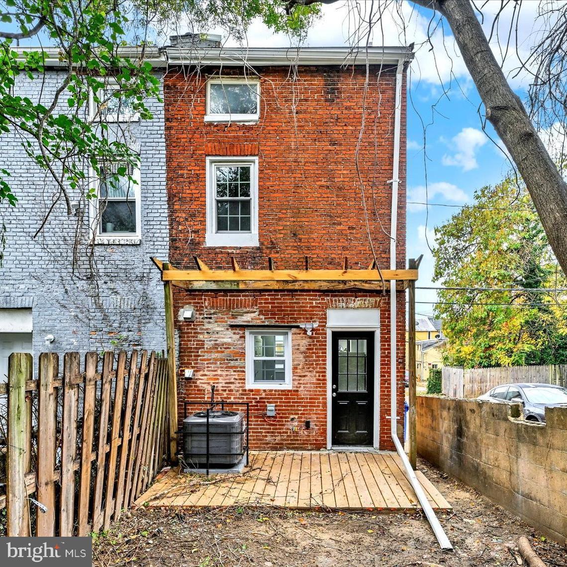 864 Lemmon Street Baltimore, MD 21201 - Photo 16 of 18 a front view of a house with a garden