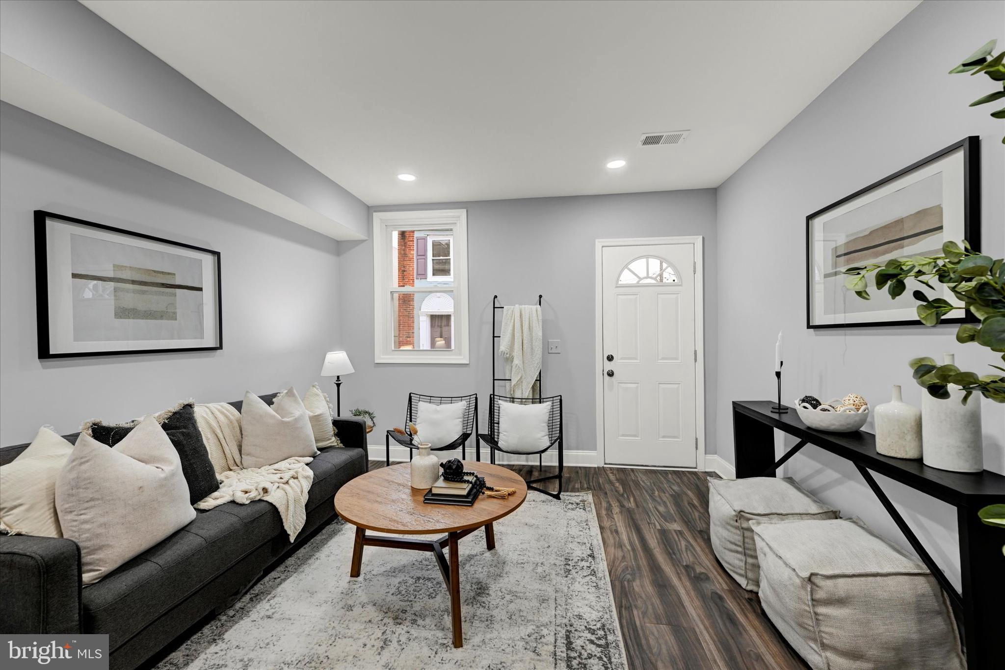 864 Lemmon Street Baltimore, MD 21201 - Photo 4 of 18 a living room with furniture and a wooden floor