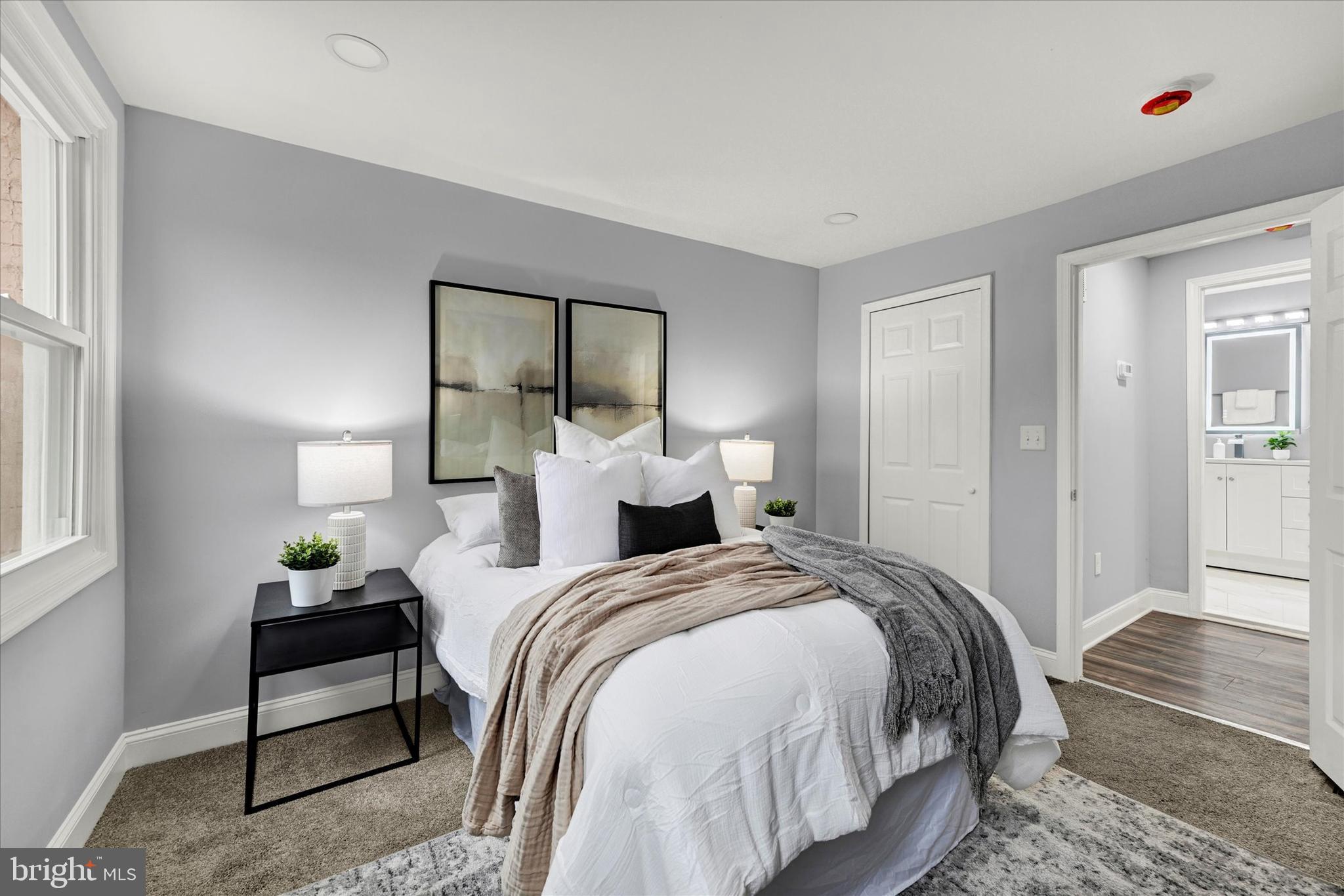 864 Lemmon Street Baltimore, MD 21201 - Photo 10 of 18 a bedroom with bed and window