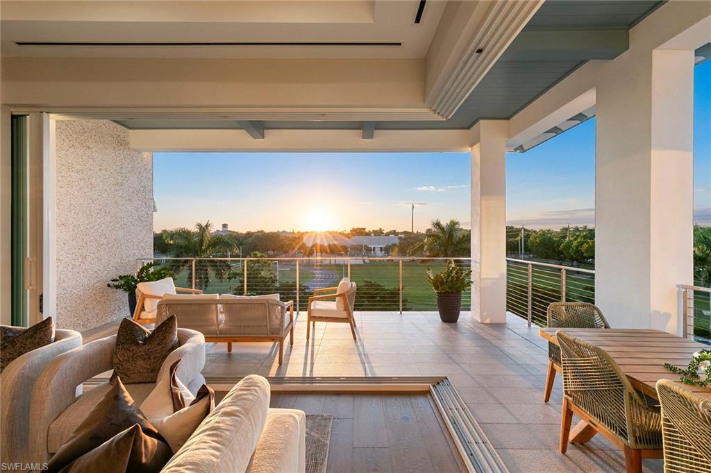 201 8th Street South, Unit 301 Naples, FL 34102 - Photo 14 of 43 a view of a balcony with couch