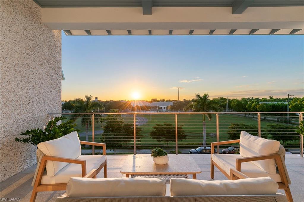 201 8th Street South, Unit 301 Naples, FL 34102 - Photo 15 of 43 a view of a roof deck with couches and sky view
